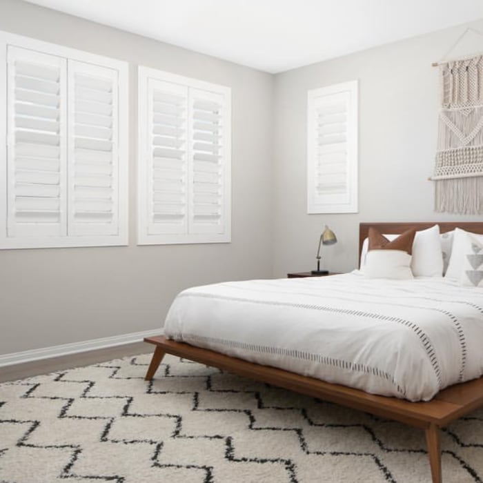 White polywood shutters in a bedroom