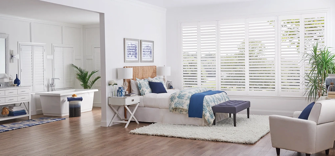 White shutters within a large window area.