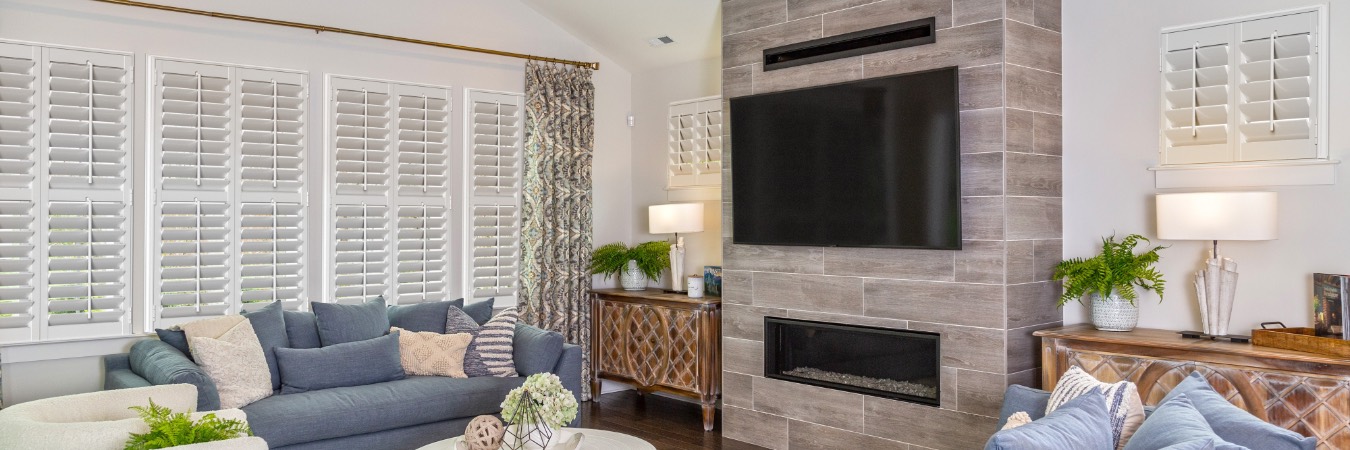 Interior shutters in Lake Mary family room with fireplace
