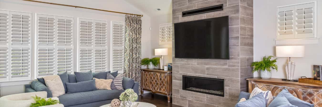 Interior shutters in Winter Park family room with fireplace