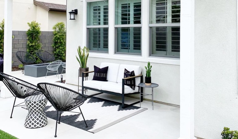 An outside patio with plantation shutters