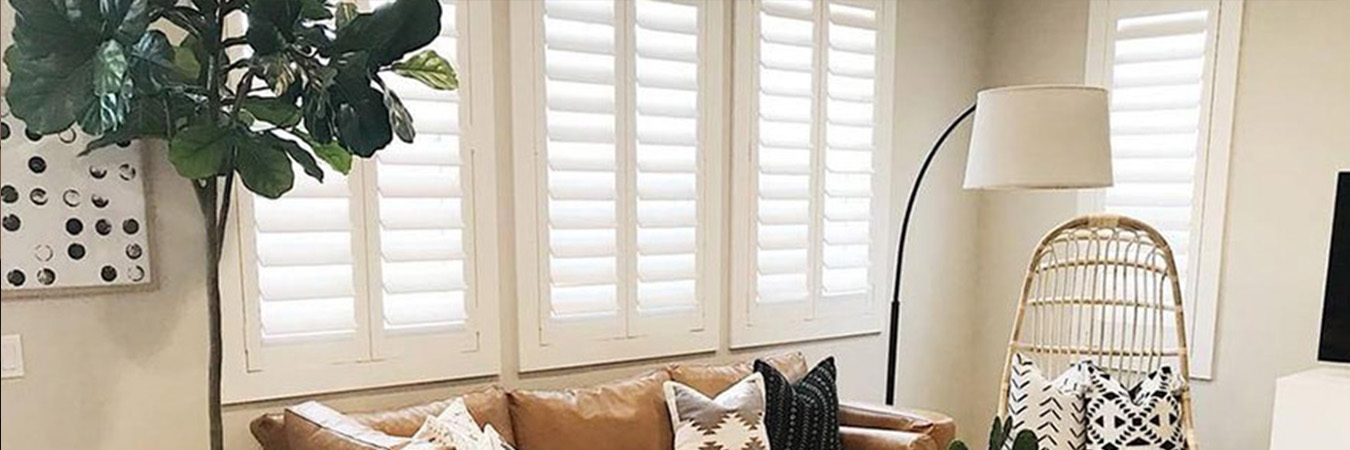 White Polywood shutters in a living room.