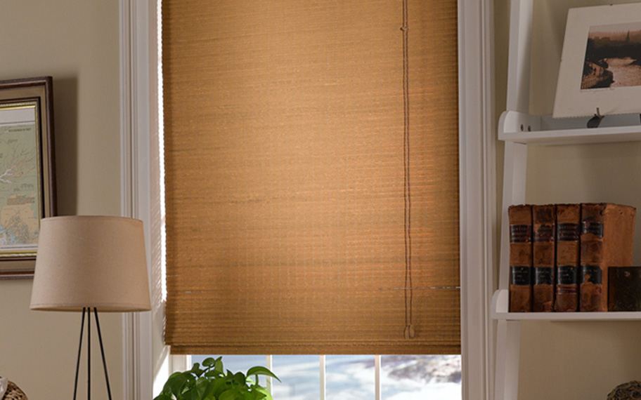 Add a touch of nature to your decor with woven fiber shades in Orlando. Tan woven fiber shades in a living room