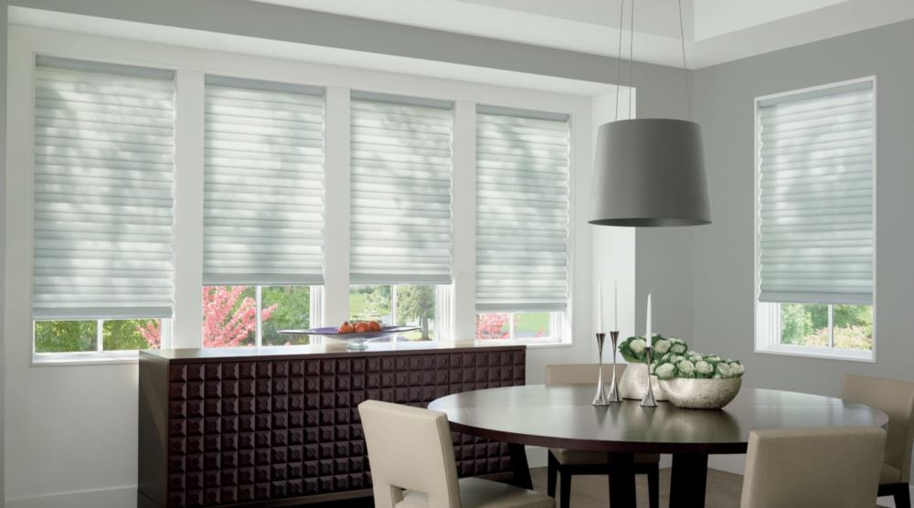 Custom cordless roller shades have a clean look and are appropriate for any room. Cordless motorized shades in a Orlando dining room