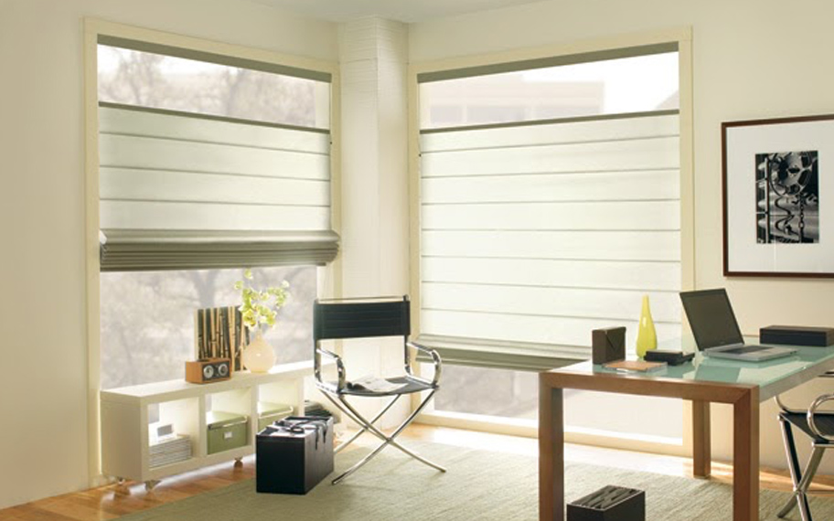 Upgrade your windows with stylish window shades or shutters in Orlando. Stylish sheer shades in the corner of a modern office.