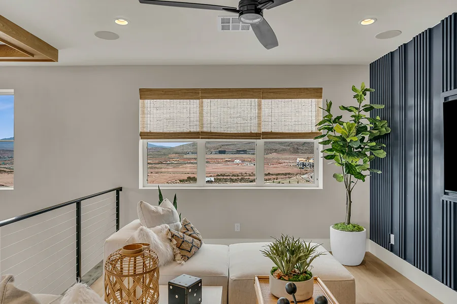 Orlando homeowners who want eco-friendly home fixtures should consider natural woven shades. Natural brown woven shades on a window in a stylish sitting area