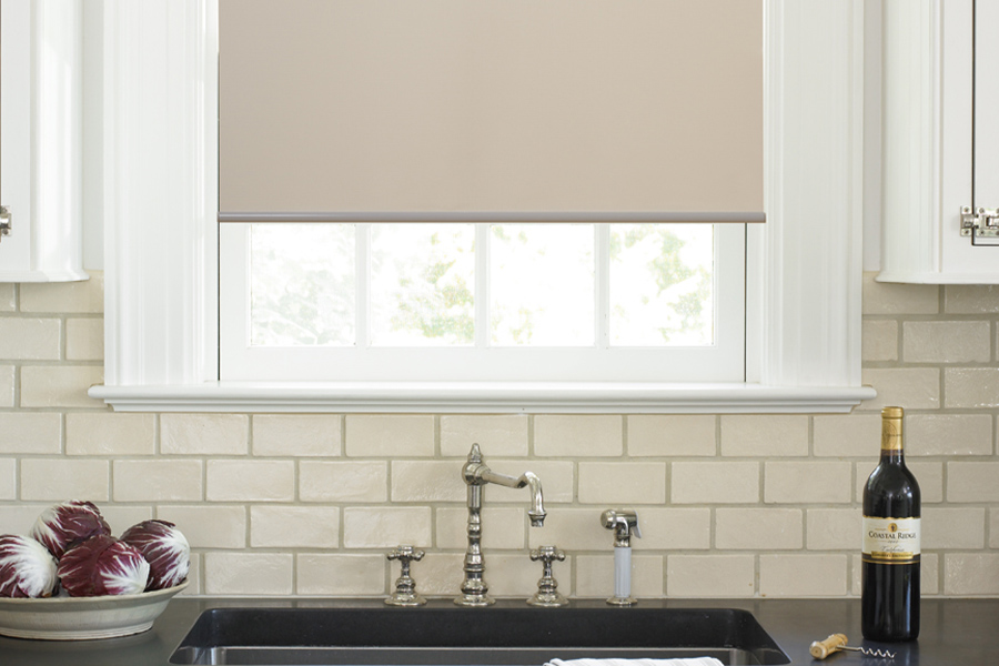 Roller shades opens up a lot of color and style options for your gourmet kitchen at Orlando. Roller shade above a kitchen sink.